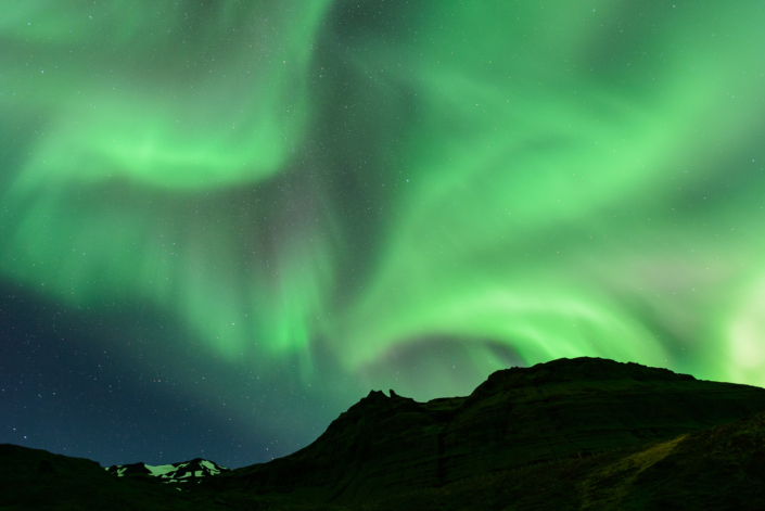 Kirkjufell sous les aurores boréales en Islande